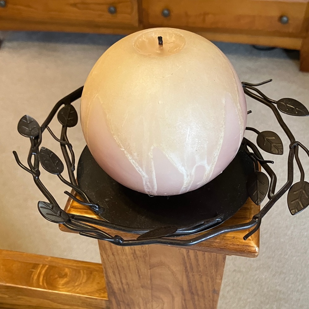 Elegant Northern lights at home. Candle with Brown Leaf Holder
